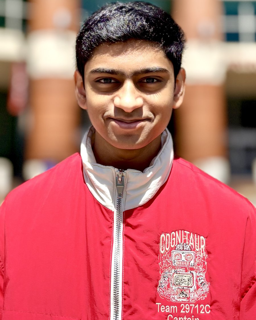 Ayushmaan Bellum, founder of Cognitaur Innovation Lab, in the red Cognitaur Team 29712C captain's jacket with the embroidered robot logo